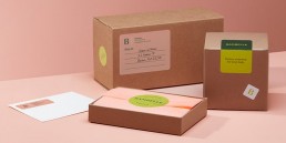 Boxes with address labels and round logo stickers