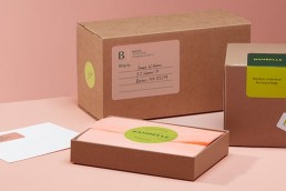 Boxes with address labels and round logo stickers